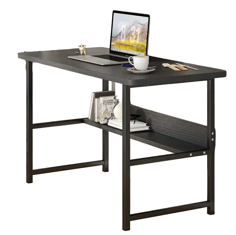 A black computer desk with a metal frame and wooden tabletop, featuring a laptop, a cup, and some books on it, placed against a wall with a decorative board and a window.