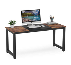 Wooden desk with computer setup on a white background