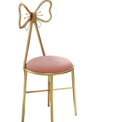 Pink chair with gold frame in a room setting