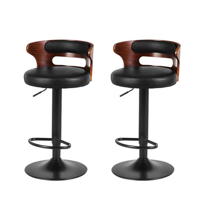 Two bar stools with wooden backrests and black seats on a white background