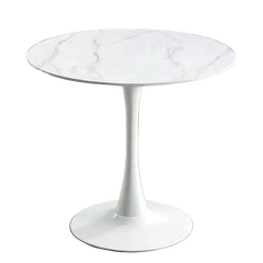 White round table with marble-like top on a gray floor.