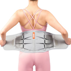 Person wearing a gray back brace with an orange label on a white background