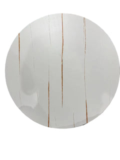 Round white board with brown vertical lines on a black surface