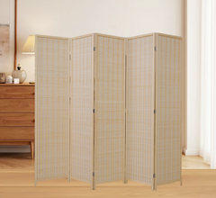 Wooden room divider in a room with wooden furniture and a lamp.