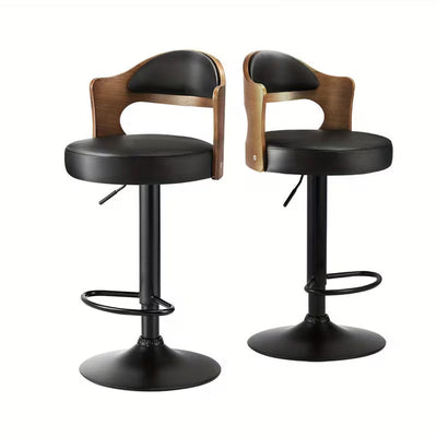 Two black bar stools with wooden backrests on a white background